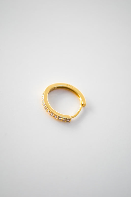 gold-colored huggie hoop earrings with cubic zirconia