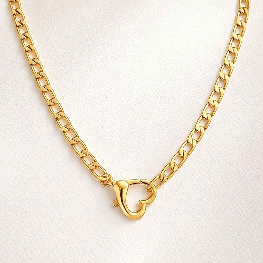 Gold heart cuban 
chain necklace with a clasp 