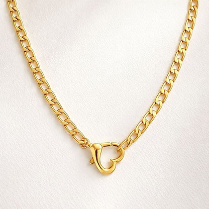 Gold heart cuban 
chain necklace with a clasp 