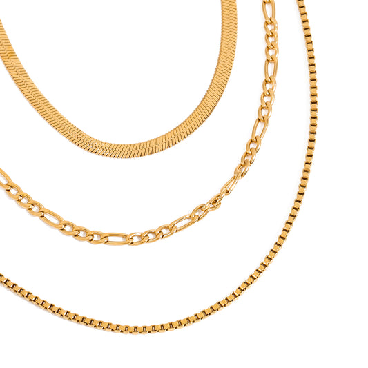 Three gold necklaces of different styles 