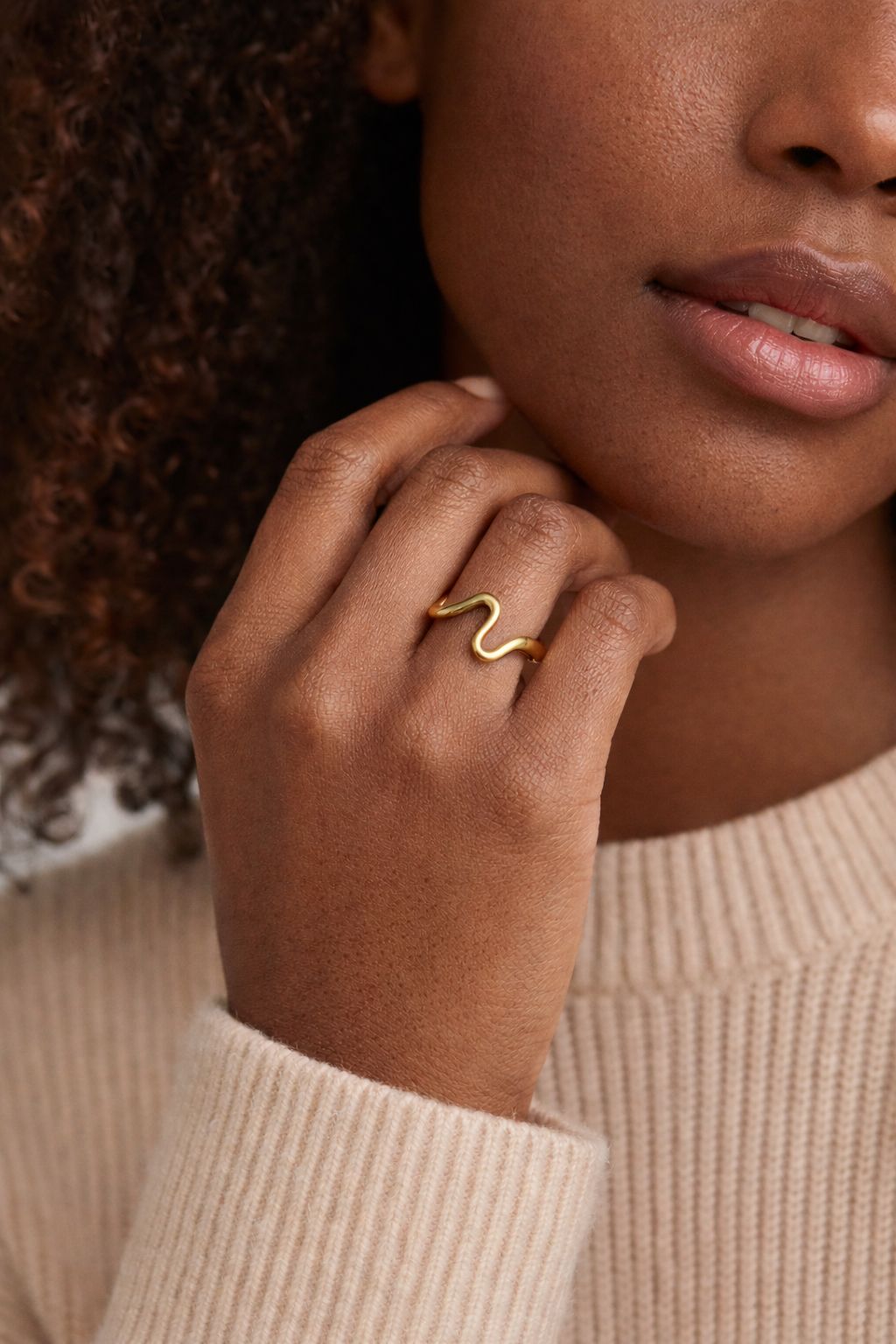 Gold wave ring on model 