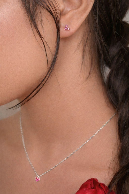 Dainty pink gemstone stud earring side view on model